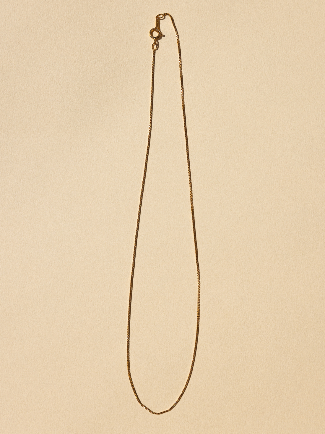 Delicate Box Chain Necklace, 18K gold-filled, full length flat lay view with lobster clasp detail.