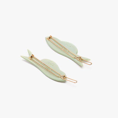 
                    
                      Jade Fish Barrette Set, green acetate, back view showing gold-toned clips and Wi logo.
                    
                  