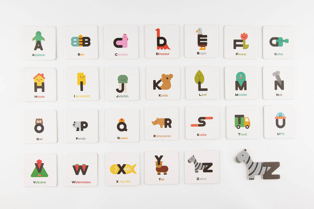 Magnetic Alphabet Play Set, full spread of colorful letter cards laid out, including the zebra magnet piece by 'Z' card.