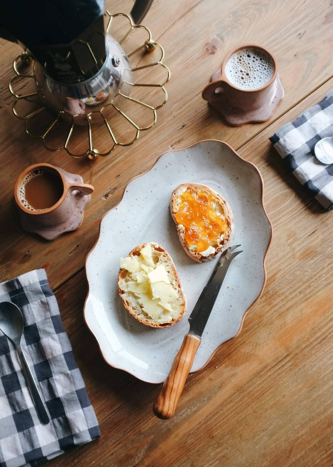 Ohyoko Ceramics Handcrafted Stoneware Tray, speckled light grey stoneware, wavy edge, overhead view with breakfast on a wood…