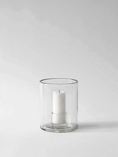 
                    
                      Luna candle holder, Small, clear recycled glass cylinder, with a white pillar candle.
                    
                  