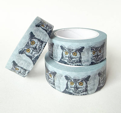 
                    
                      Great Horned Owl washi tape, blue-grey with black & white owl pattern, yellow eyes. Three rolls, two stacked.
                    
                  