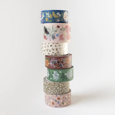 
                    
                      Song Birds washi tape, a stack of seven rolls, each featuring unique floral, bird, and butterfly patterns with gold foil…
                    
                  