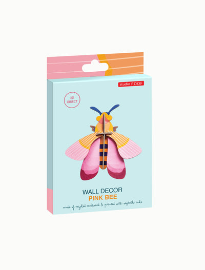 
                    
                      Studio Roof Pink Bee 3D wall decor kit packaging, light blue box with pink and orange striped top, angled front view.
                    
                  