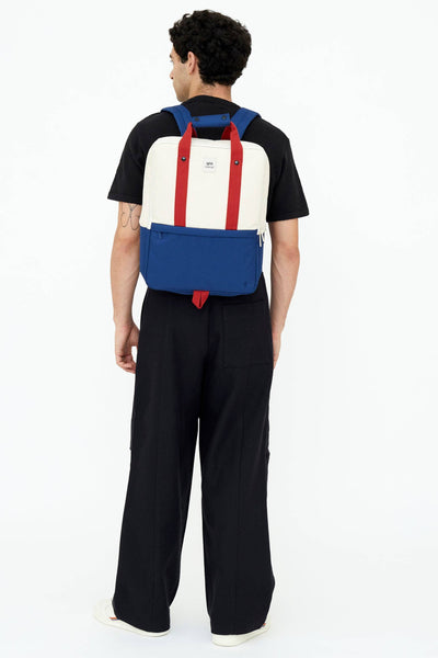 
                    
                      Lefrik Daily 15" Bauhaus Block backpack, cream, blue, red Oxford RPET fabric. Back view worn on model.
                    
                  
