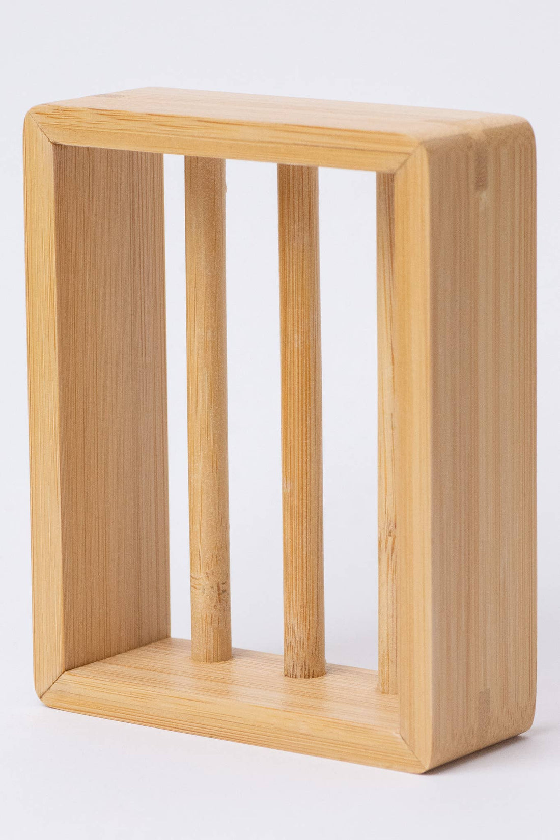 Moso Bamboo Soap Shelf, natural light bamboo wood with rounded corners, angled view highlighting three vertical support rods.