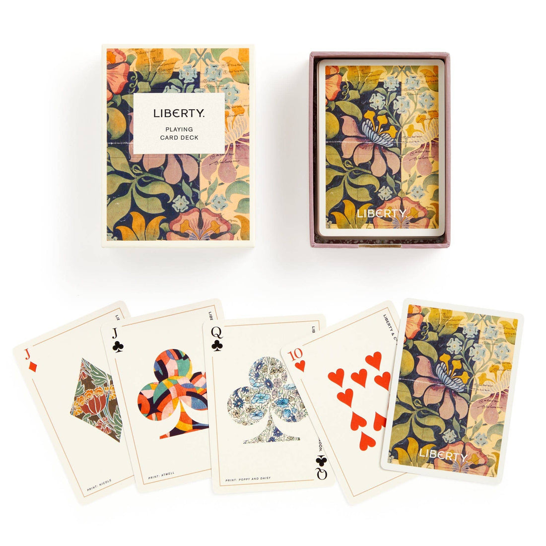 Liberty Archive playing card deck, two floral-patterned boxes and five fanned-out cards showing unique suit designs and…