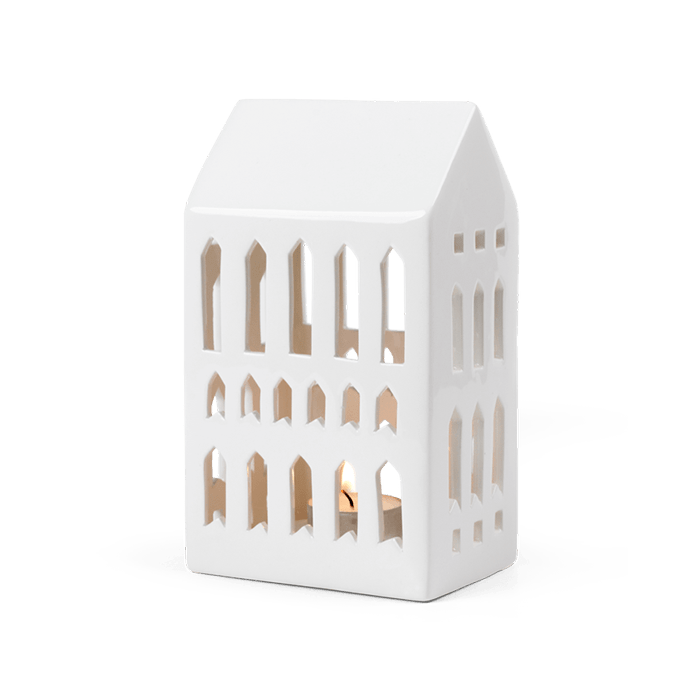 Danish Design Collective Urbania Church ceramic lighthouse candle holder, white dolomite ceramic, angled front view with lit…