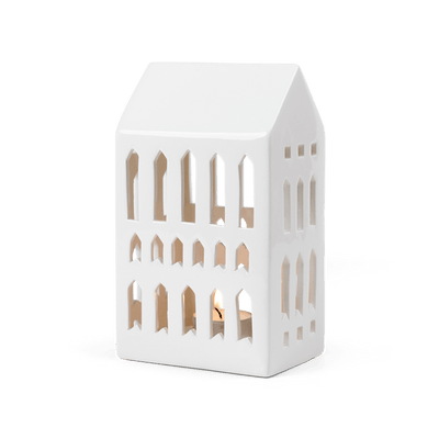 
                    
                      Danish Design Collective Urbania Church ceramic lighthouse candle holder, white dolomite ceramic, angled front view with lit…
                    
                  