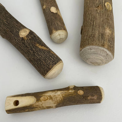 
                    
                      Sansho Surikogi Japanese Prickly Ash Wood Twig Pestle, natural bark texture, smoothed ends, and drilled hole detail.
                    
                  