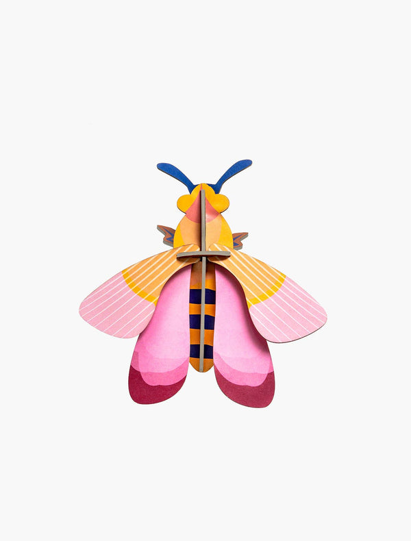 Studio Roof Pink Bee 3d build kit, recycled cardboard, pink, yellow, blue, orange, red, striped wings, front on white