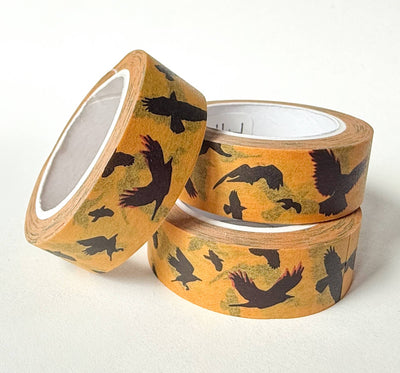 
                    
                      Flying Crows washi tape, three rolls stacked. Yellow pattern with black bird silhouettes, highlighting rice paper texture.
                    
                  