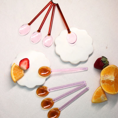 
                    
                      Pink and Amber Borosilicate Stirring Spoons, group flat lay with fruit, varied pink and amber glass, some bowls holding…
                    
                  