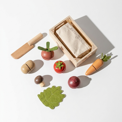 
                    
                      Wooden Vegetables Playset toys: natural wood knife, colorful vegetables, green felt leaf, and storage crate, flat lay.
                    
                  