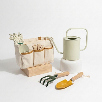 
                    
                      Coco Village Gardening Tools Playset, 12-piece toy set: cream canvas tote, pale green watering can, yellow & green metal…
                    
                  