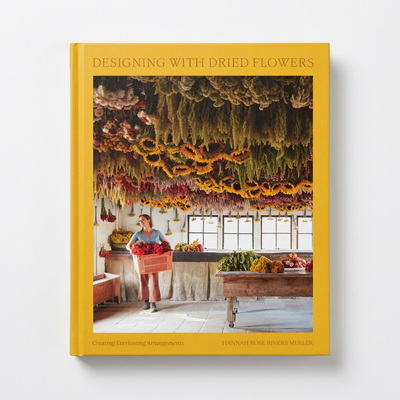 
                    
                      Penguin Random House Designing with Dried Flowers hardcover book, yellow cover with dried flowers display and woman, front…
                    
                  