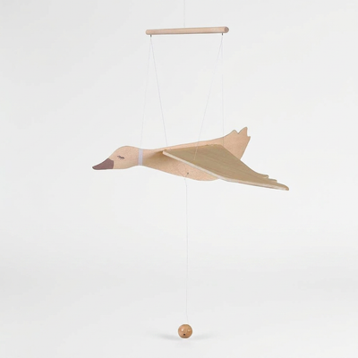 
                    
                      Wooden Flying Goose mobile, natural wood with painted olive green wings, dark brown beak, side view showing pull cord and…
                    
                  