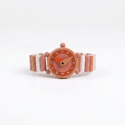 
                    
                      Emma wooden watch, round pink face with orange hands, segmented natural wood, pink, and white elastic strap, straight-on…
                    
                  