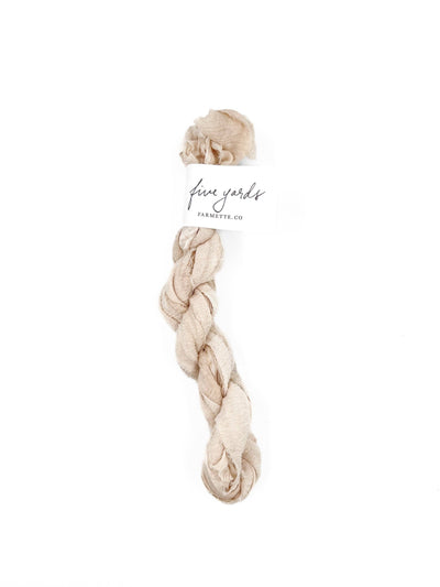 
                    
                      Farmette Plant-Dyed Sari Silk Ribbon, Lace off-white, 5-yard coil with textured weave and brand label.
                    
                  