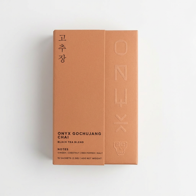 
                    
                      Onyx Coffee Lab Gochujang Chai black tea blend box, terracotta, with Korean text and embossed ONYX logo, front and side view…
                    
                  