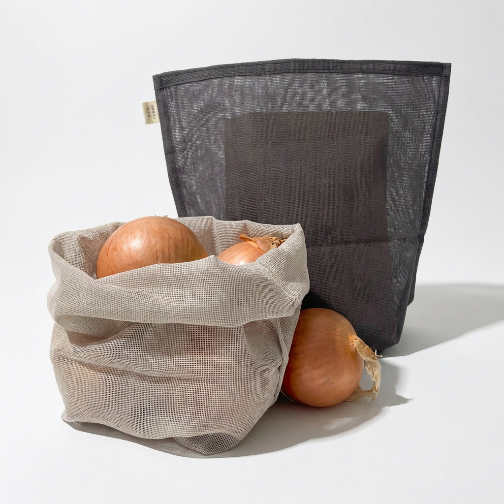 Ban Inoue Japanese Cotton Gauze Storage Bags: natural bag with onions, charcoal bag, front view on white.