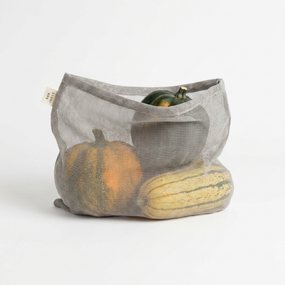 
                    
                      Gray cotton gauze kitchen storage bag, filled with assorted gourds, front view showcasing mesh material.
                    
                  