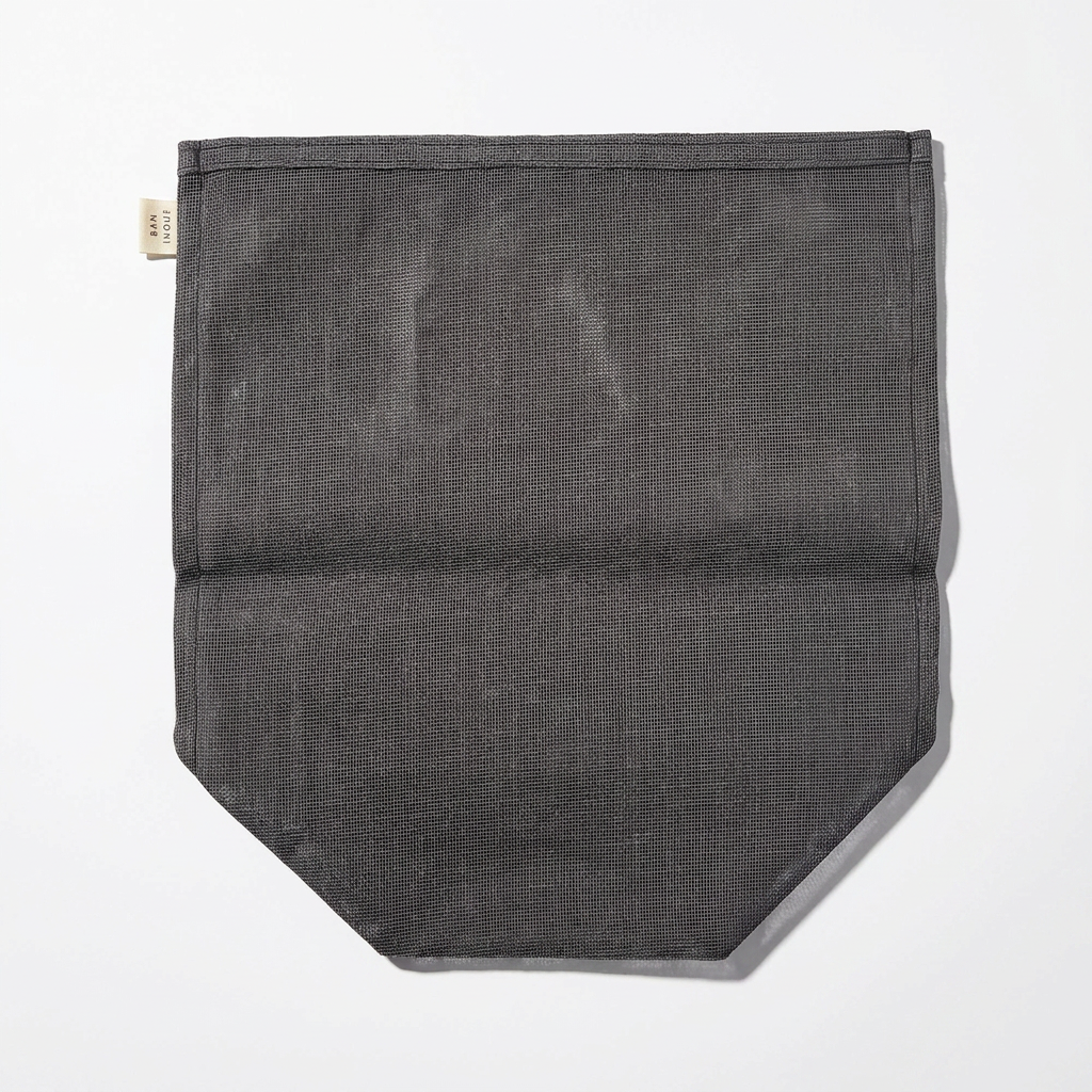 Ban Inoue Japanese Cotton Gauze Kitchen Storage Bag, dark gray, close-up of fabric texture, bottom corner, and brand tag.