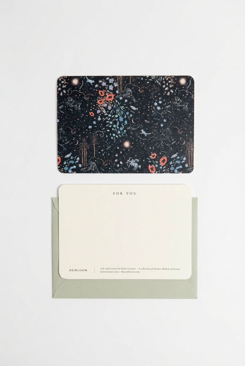 Greeting card with zodiac-themed design and envelope on a white background