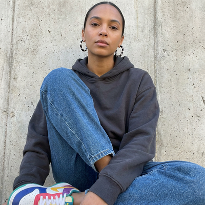 
                    
                      Sol hoop earrings, black and white tortoise acetate, worn on ears against concrete background.
                    
                  