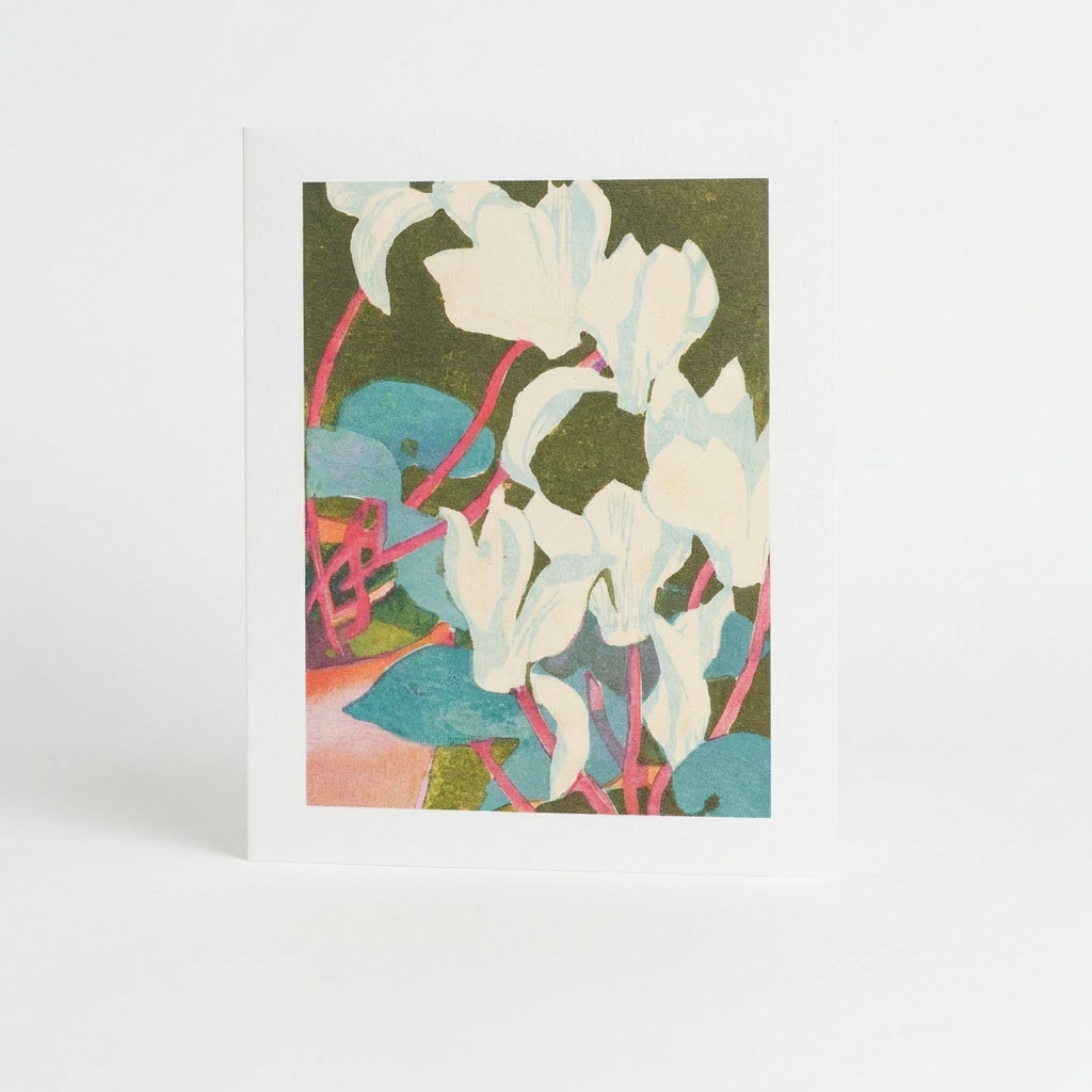 Art Angels Cyclamen Greeting Card by Mabel Royds, white flowers, teal leaves, pink stems on dark green, front view.