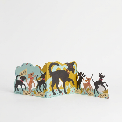 
                    
                      Art Angels Puppy Parade Die-Cut Card by Mark Hearld, unfolded multi-colored dog illustration, front view on white.
                    
                  