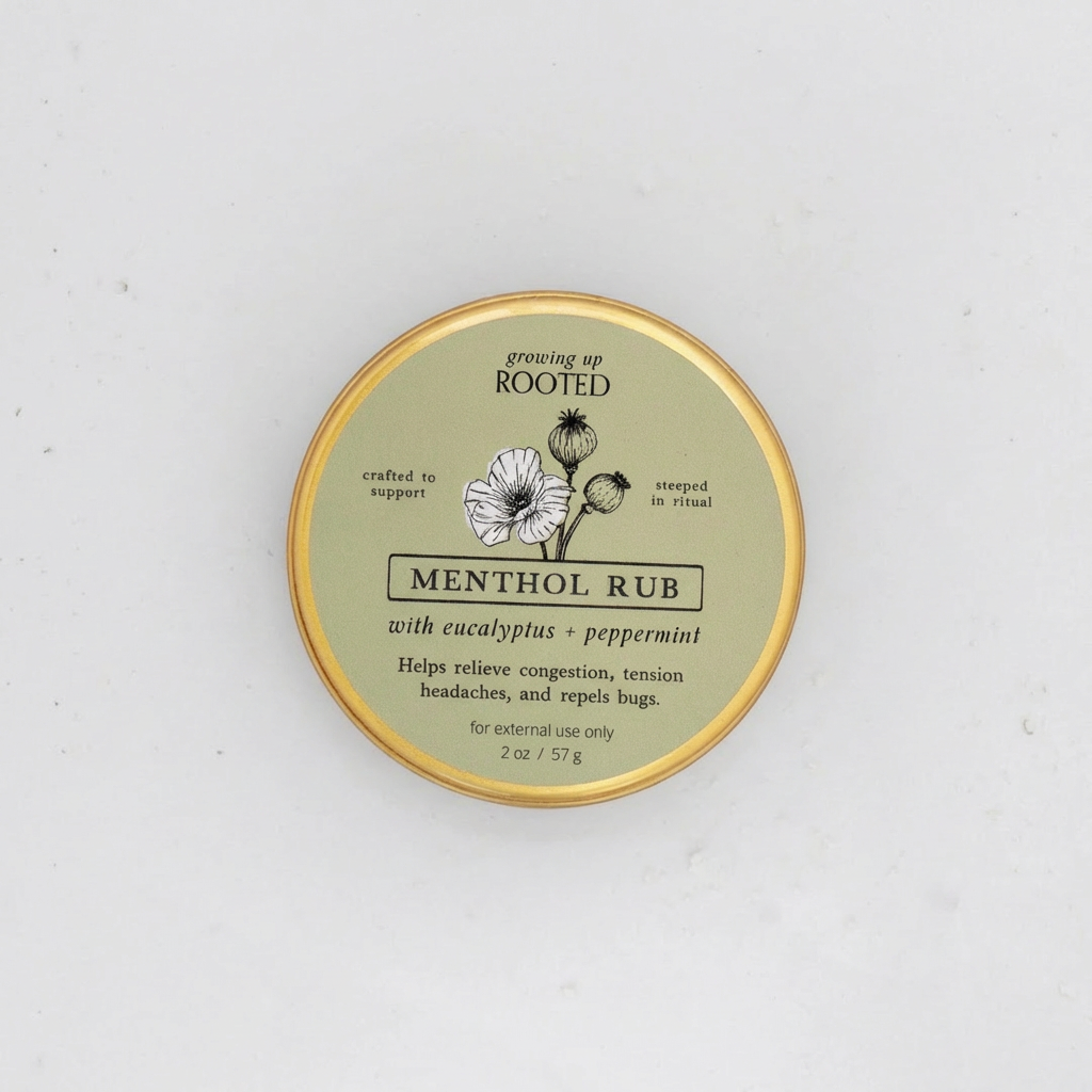Menthol Rub 2 oz tin, light green label with black & white floral illustration, top-down close-up view.