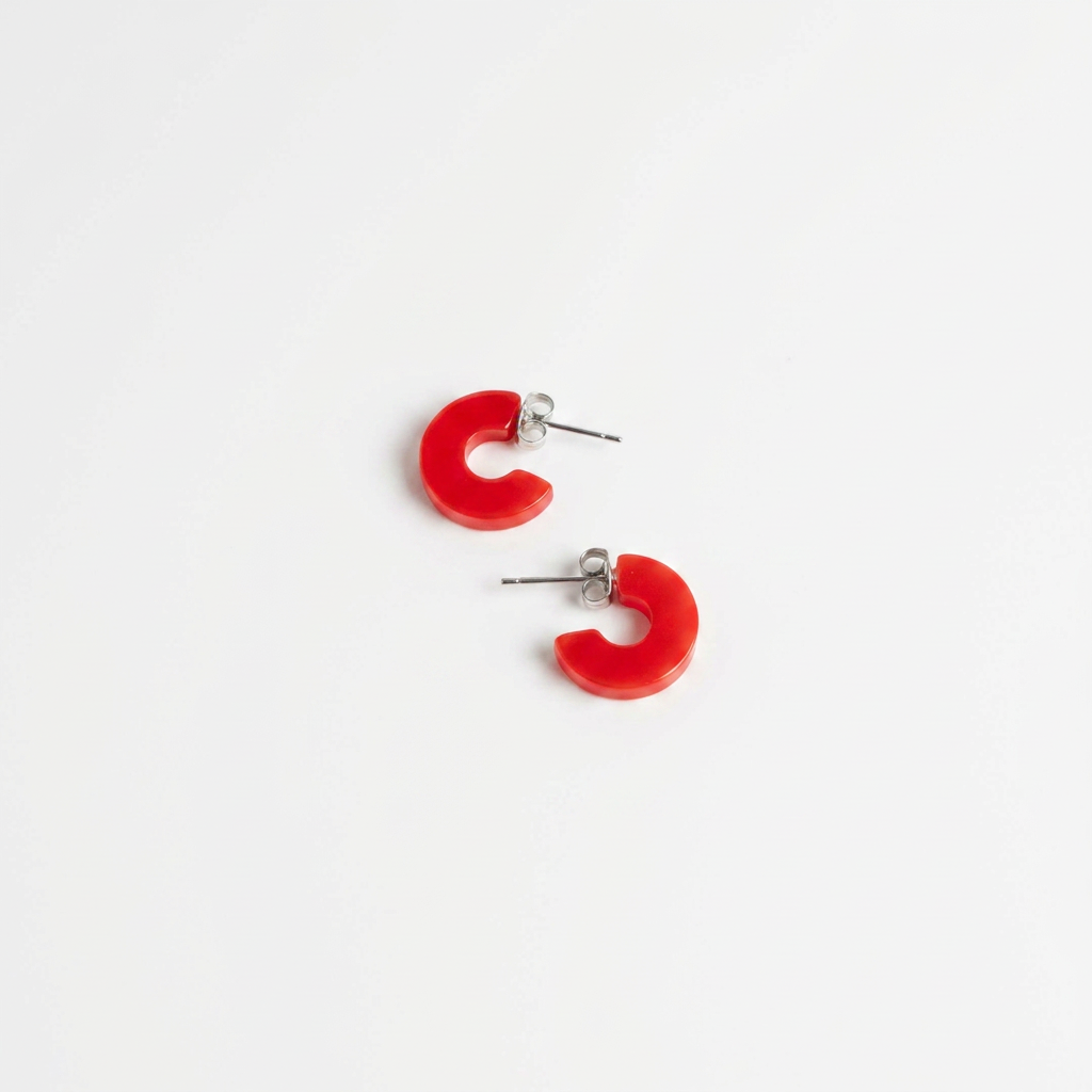 NAT + NOOR Mali Cherry Red hoop earrings, opaque acetate with silver stainless steel posts, flat lay pair on white.
