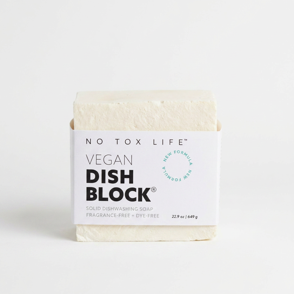 No Tox Life Dish Block solid dish soap, natural off-white block with white branded label, front view on white.