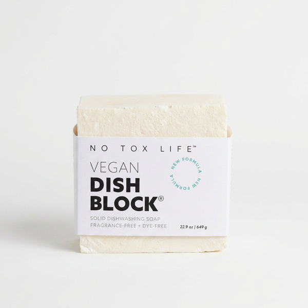 No Tox Life Dish Block solid dish soap, natural off-white block with white branded label, front view on white.
