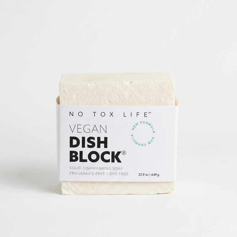 No Tox Life Dish Block solid dish soap, natural off-white block with white branded label, front view on white.