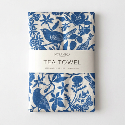 
                    
                      Botanica Paper Co. Songbirds Linen Tea Towel, blue and white bird and floral pattern, folded with product label, front view…
                    
                  
