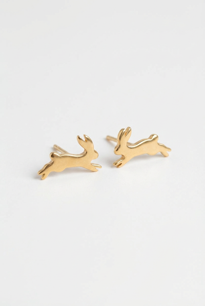 
                    
                      Peter + June Fortune Bunny stud earrings, 18K gold-plated brass, flat lay pair on white.
                    
                  