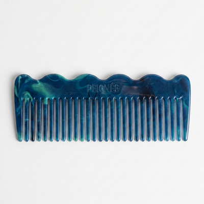 
                    
                      Peignee Paris Signature Wide-Tooth Wave Comb, rivoli blue and green marbled plant-based cellulose acetate, front on white.
                    
                  