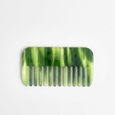 
                    
                      Peignee Paris Travel Wide-Tooth Wave Comb, emerald marbled plant-based cellulose acetate, front view on white.
                    
                  