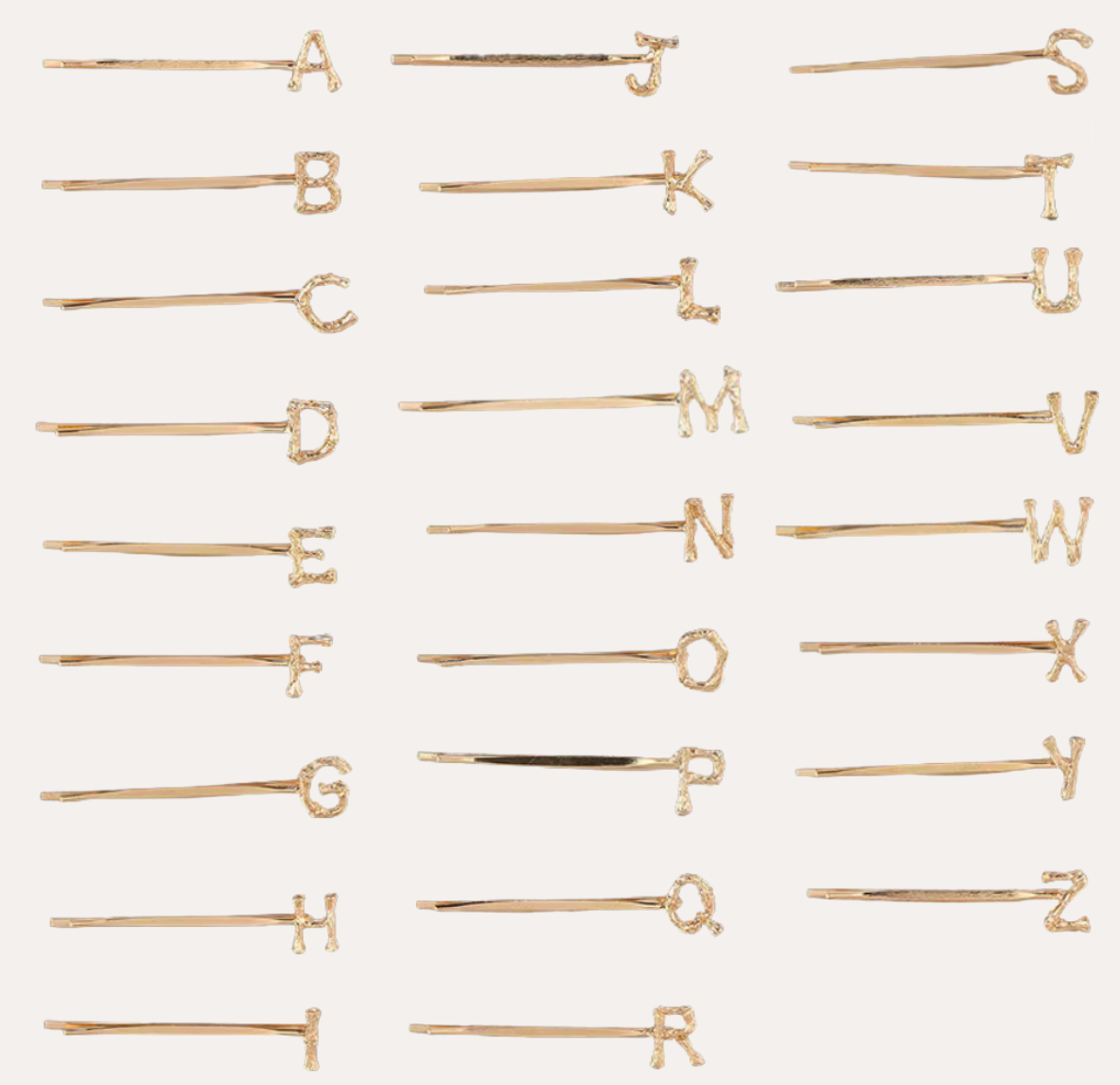 Peignée Alphabet Letter Hair Clip - Gold Plated. Gold hairpins with letters arranged in a grid on a white background