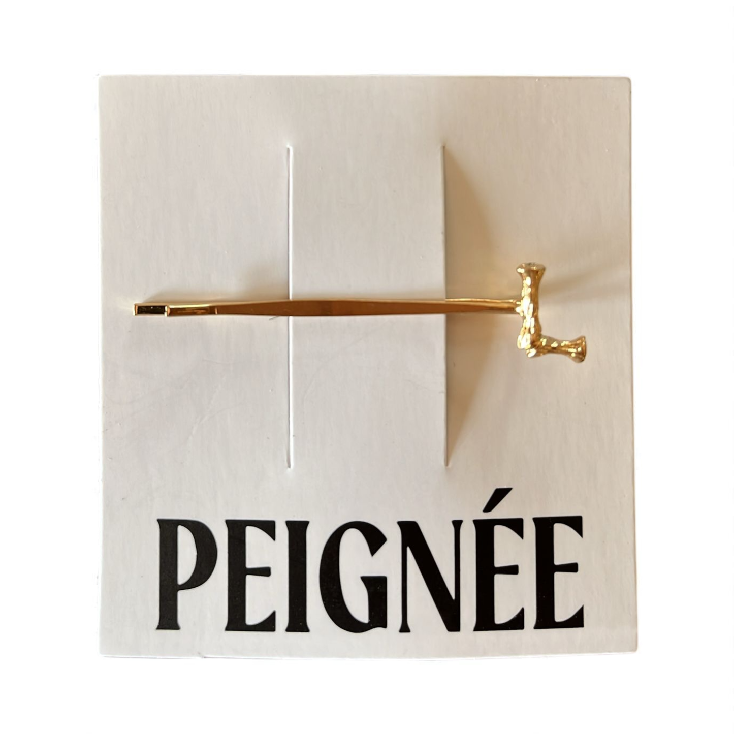 Peignée Alphabet Letter Hair Clip - Gold Plated. Gold hair clip on a white background with 'Peigné' text