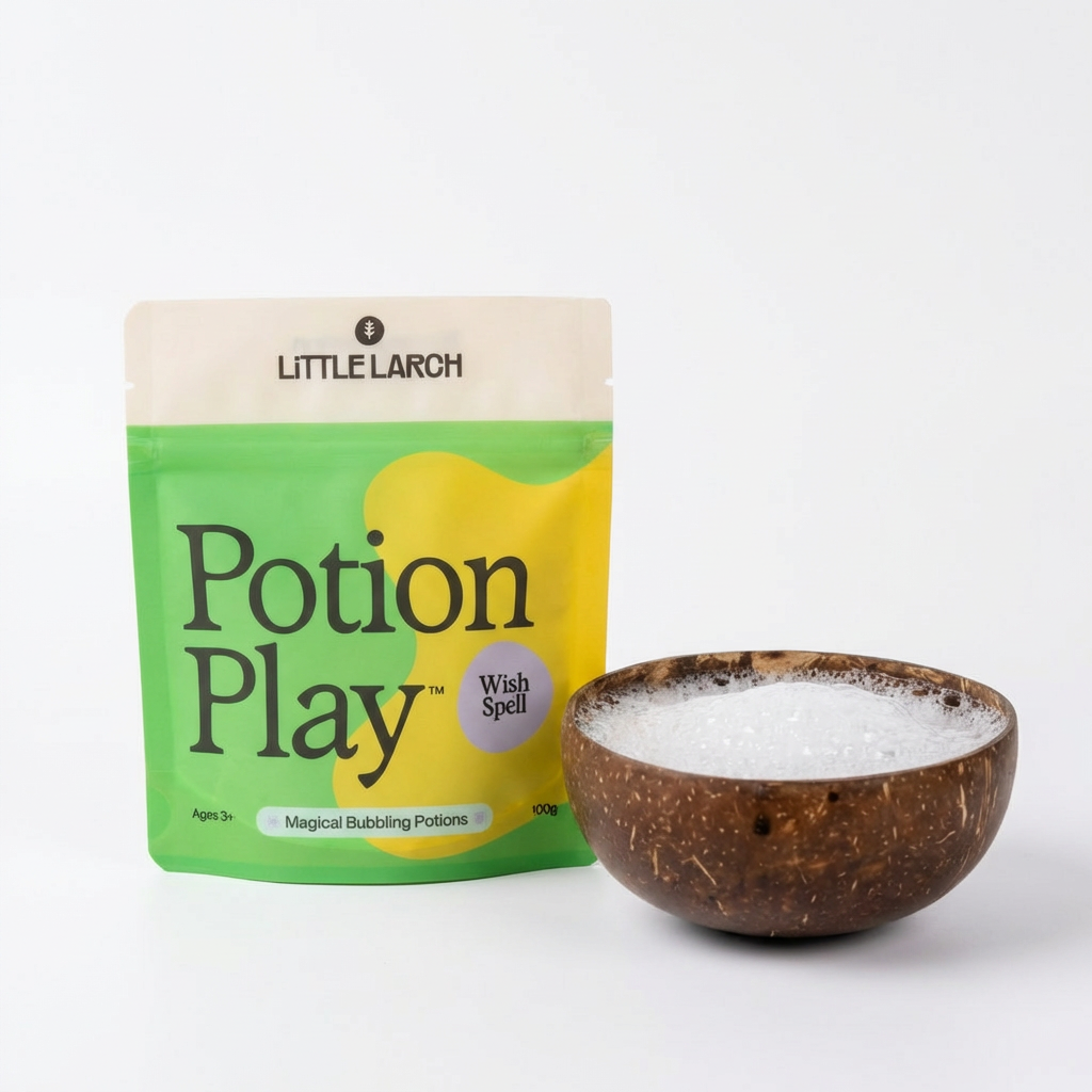 Little Larch Potion Play packaging with a coconut bowl containing a pretend magic potion, placed on a light gray background.