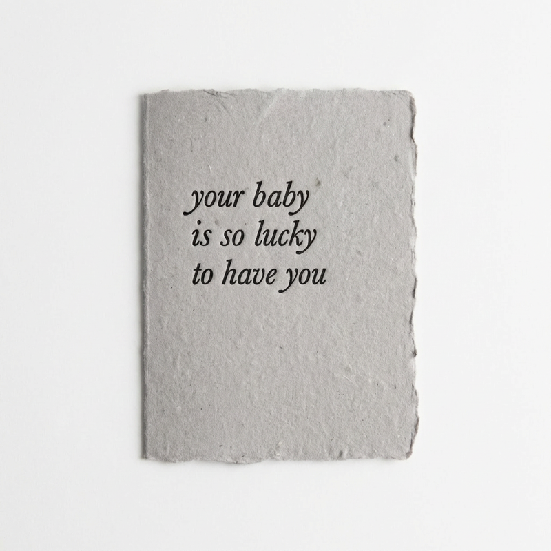 Handmade letterpress card with 'your baby is so lucky to have you' text on a white background