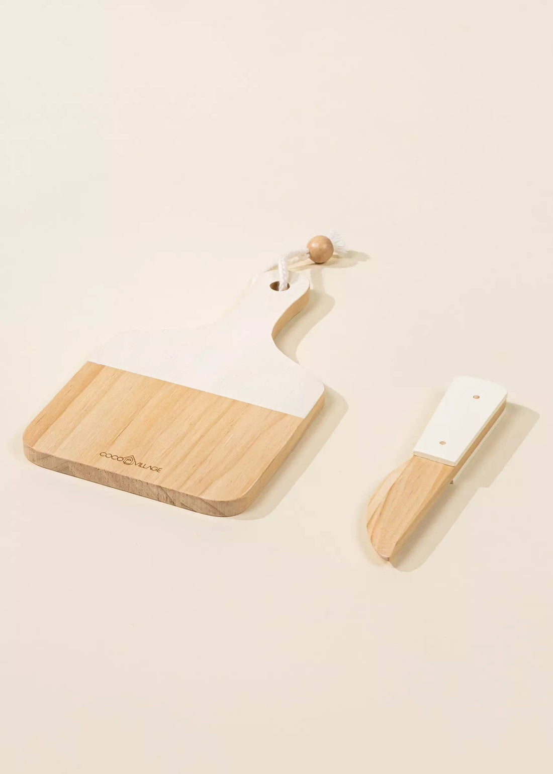 Coco Village Wooden Bakery Set toys: natural wood cutting board with white top, wood bead detail, and matching wood knife