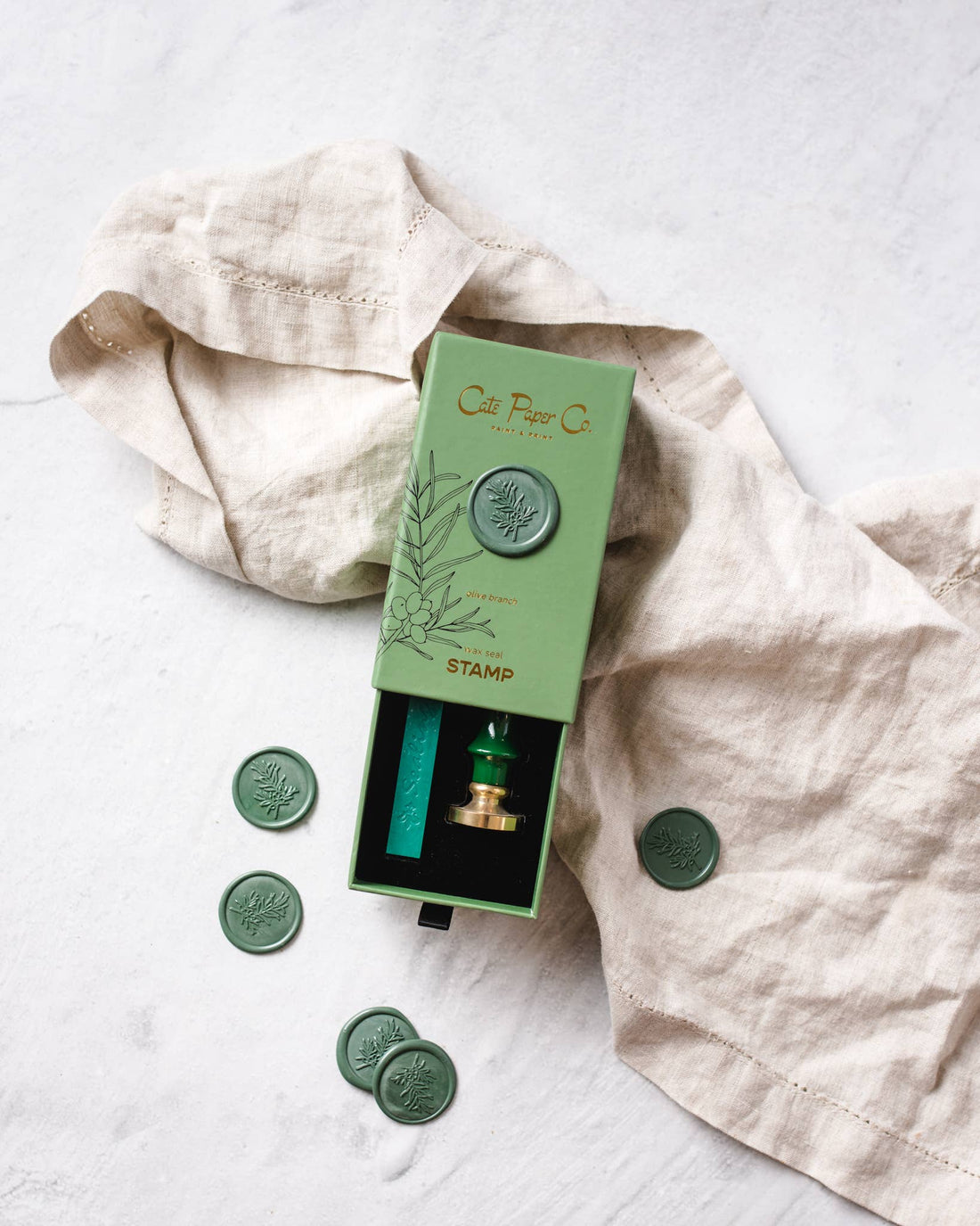 Cate Paper Co. Wax Seal Stamp & Wax Stick Set, green wax & brass stamp, olive branch design, partially open box with…