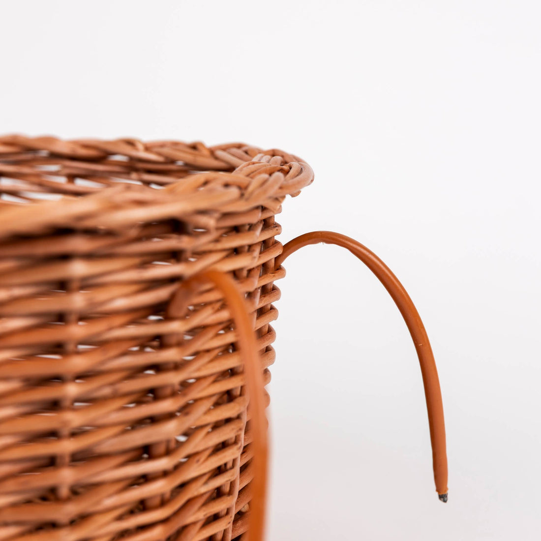 Wicker Bike Seat for Dolls, close-up of natural woven wicker texture and brown attachment strap connection.