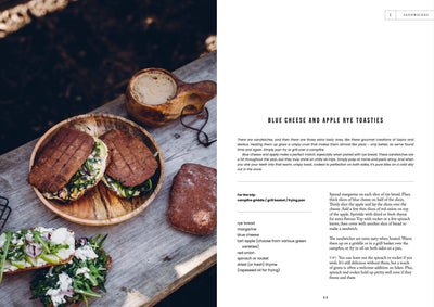 
                    
                      Food Over the Campfire print book, open page with 'Blue Cheese and Apple Rye Toasties' recipe next to photo of grilled…
                    
                  