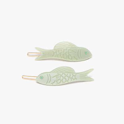 
                    
                      Jade Fish barrette set, green acetate, flat lay of two with engraved scales, fins, and gold clips.
                    
                  