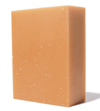 
                    
                      Geranium bar soap, olive oil base, light orange color with natural speckles, standing upright close-up.
                    
                  